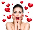 Beauty surprised woman with flying red hearts Royalty Free Stock Photo