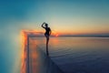 Beauty surreal sunset with woman on salty lake Royalty Free Stock Photo