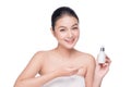 Beauty treatment. Asian woman holding serum treatment bottle