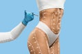 Young fit woman getting injection in her waist area Royalty Free Stock Photo