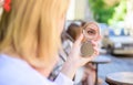 Beauty treatment and skin care concept. Reflexion girl looking in mirror check her appearance. Woman looking in her Royalty Free Stock Photo