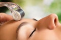 Beauty treatment with skin derma roller. Royalty Free Stock Photo