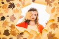 Beauty trends. Makeup girl peek through torn paper. Pretty girl cover face with autumn leaf. Young woman look out of Royalty Free Stock Photo