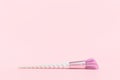 Beauty unicorn makeup brush on monochrome pink