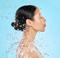 Beauty, water and face profile of woman on blue background for wellness, healthy skin and cleaning. Bathroom, shower and Royalty Free Stock Photo