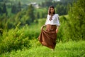 Beauty wearing Romanian blouse called ie