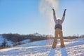 Beauty Winter Girl Blowing Snow in frosty winter Park. Outdoors. Flying Snowflakes. Sunny day. Backlit. Beauty young woman Having Royalty Free Stock Photo