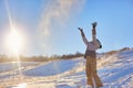 Beauty Winter Girl Blowing Snow in frosty winter Park. Outdoors. Flying Snowflakes. Sunny day. Backlit. Beauty young woman Having Royalty Free Stock Photo