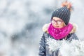 Beauty Winter Girl Blowing Snow in frosty winter park or outdoors. Girl and winter cold weather Royalty Free Stock Photo