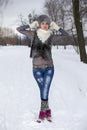 Beauty Winter Girl in frosty winter Park. Outdoors. Flying Snowflakes. Joyful Beauty young woman Having Fun in Winter Park. Royalty Free Stock Photo