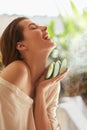 Beauty. Woman With Aloe Vera. Portrait Of Happy Model With Naked Shoulder And Natural Makeup Holding Slices Of Leaf. Royalty Free Stock Photo