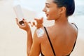 Beauty Woman applying sunscreen creme. Skin care. Body Sun protection sun cream. Royalty Free Stock Photo