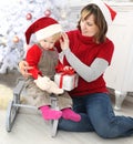 Beauty woman and child at christmas decoration Royalty Free Stock Photo