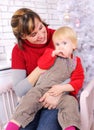 Beauty woman and child at christmas decoration Royalty Free Stock Photo