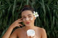 Beauty Woman Concept. Skin care. Young model with Soft skin holding cosmetic cream. Portrait of female applying moisturizing cream Royalty Free Stock Photo