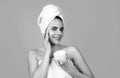 Beauty woman with cosmetic products clean healthy natural skin. Portrait of attractive young girl with a bath towel on Royalty Free Stock Photo