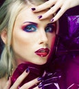 Beauty woman with creative make up, many fingers on face close up