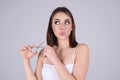 Beauty woman cutting hair with scissors isolated on studio background. Beautiful girl about to cut hair. Hair cut Royalty Free Stock Photo