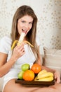 Beauty woman is eating banana Royalty Free Stock Photo