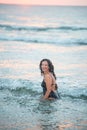 Beauty woman in the sea with many drops