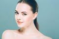 Beauty Woman face Portrait. Beautiful Spa model Girl with Perfect Fresh Clean Skin. Blue background. Royalty Free Stock Photo