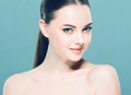 Beauty Woman face Portrait. Beautiful Spa model Girl with Perfect Fresh Clean Skin. Blue background. Royalty Free Stock Photo