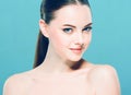 Beauty Woman face Portrait. Beautiful Spa model Girl with Perfect Fresh Clean Skin. Blue background. Royalty Free Stock Photo