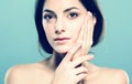 Beauty Woman face Portrait. Beautiful Spa model Girl with Perfect Fresh Clean Skin. Blue background gray Royalty Free Stock Photo
