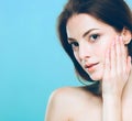 Beauty Woman face Portrait. Beautiful Spa model Girl with Perfect Fresh Clean Skin. Blue background gray Royalty Free Stock Photo