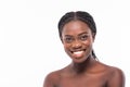 Beauty African Woman face Portrait. Beautiful Spa model Girl with Perfect Fresh Clean Skin. Brunette female looking at camera and Royalty Free Stock Photo
