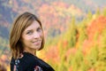 Beautiful Woman face Portrait with autumn landscape background