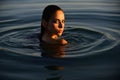 Beauty Woman face Portrait. Summer beautiful Girl. Young woman against blue water, good summer resort. Lovely fit female