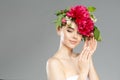 Beauty woman with flowers on head. Happy beautiful girl on gray banner background. Pretty model with clear skin. Spring fashion Royalty Free Stock Photo