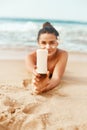 Beauty Woman holding bottles of sunscreen in her hands. Girl applying sun cream on face. Skin care. Sun protection . Royalty Free Stock Photo