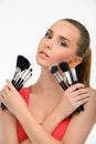 Beauty woman holding set of brushes. Royalty Free Stock Photo