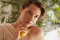 Beauty. Woman With Lemon Touching Face. Portrait Of Model With Natural Makeup, Glowing And Hydrated Facial Skin. Royalty Free Stock Photo