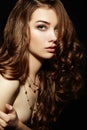 Beauty woman with long curly hair. Beautiful girl with elegant h