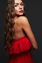 Beauty woman with long curly hair.Beautiful girl in red dress Royalty Free Stock Photo