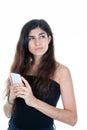 beauty woman with long hair brunette holding a phone smartphone in hand look side Royalty Free Stock Photo