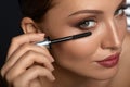 Beauty Woman Makeup. Beautiful Woman Applying Black Mascara Royalty Free Stock Photo