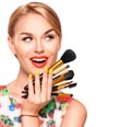 Beauty woman with makeup brushes Royalty Free Stock Photo