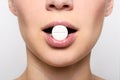 Beauty woman mouth with red lips and medicine pill