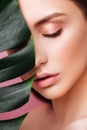 Beauty Woman with natural green palm leaf Portrait Royalty Free Stock Photo