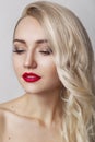 Beauty Woman with Perfect Makeup. Beautiful Professional Holiday Make-up. Red Lips and Nails. Beauty Girl`s Face isolated on Black Royalty Free Stock Photo