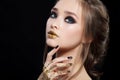 Beauty Woman Portrait. Professional Makeup and Manicure with gold foil glitter, smokey eyes. Black colors. Copy-space Royalty Free Stock Photo