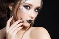 Beauty Woman Portrait. Professional Makeup and Manicure with silver foil glitter, smokey eyes. Black colors. Copy-space Royalty Free Stock Photo