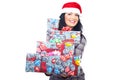 Beauty woman in Santa hat giving gifts Royalty Free Stock Photo