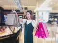 Beauty Woman with Shopping Bags in Shopping Mall. Shopper. Sales