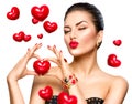 Beauty woman showing red heart in her hands