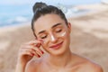 Beauty Woman smile applying sun cream  on face. Skincare. Body Sun protection. sunscreen. Royalty Free Stock Photo